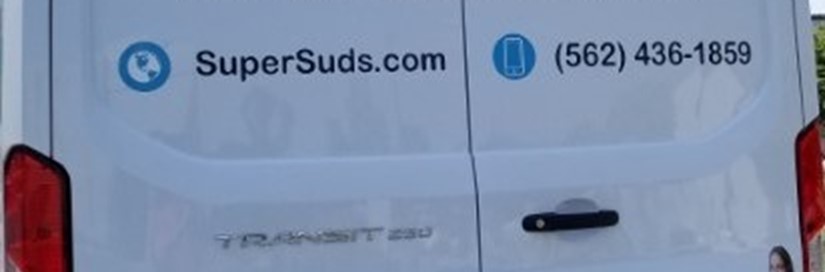 Super Suds Van with phone number on the side
