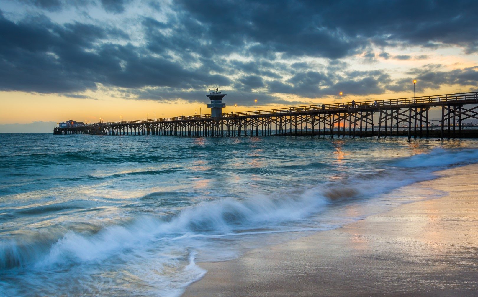 Seal Beach With Pier And Waves