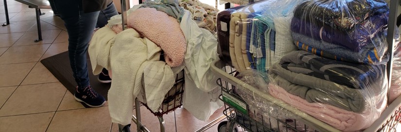 Pile of clothes on laundry cart